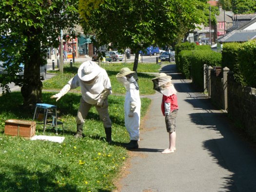 Beekeeper John Young and his assistants