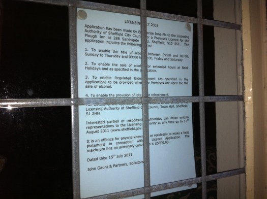 Notification up in the window of The Plough pub on Sandygate Road