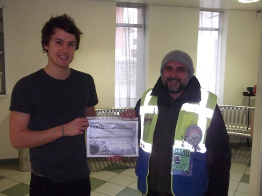 Crosspool Big Issue in the North seller Mohammad Iqbal picks up his award