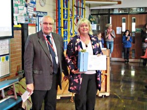 Glenda Debrouwer receives Crosspool Forum Community award from chair Ian Hague